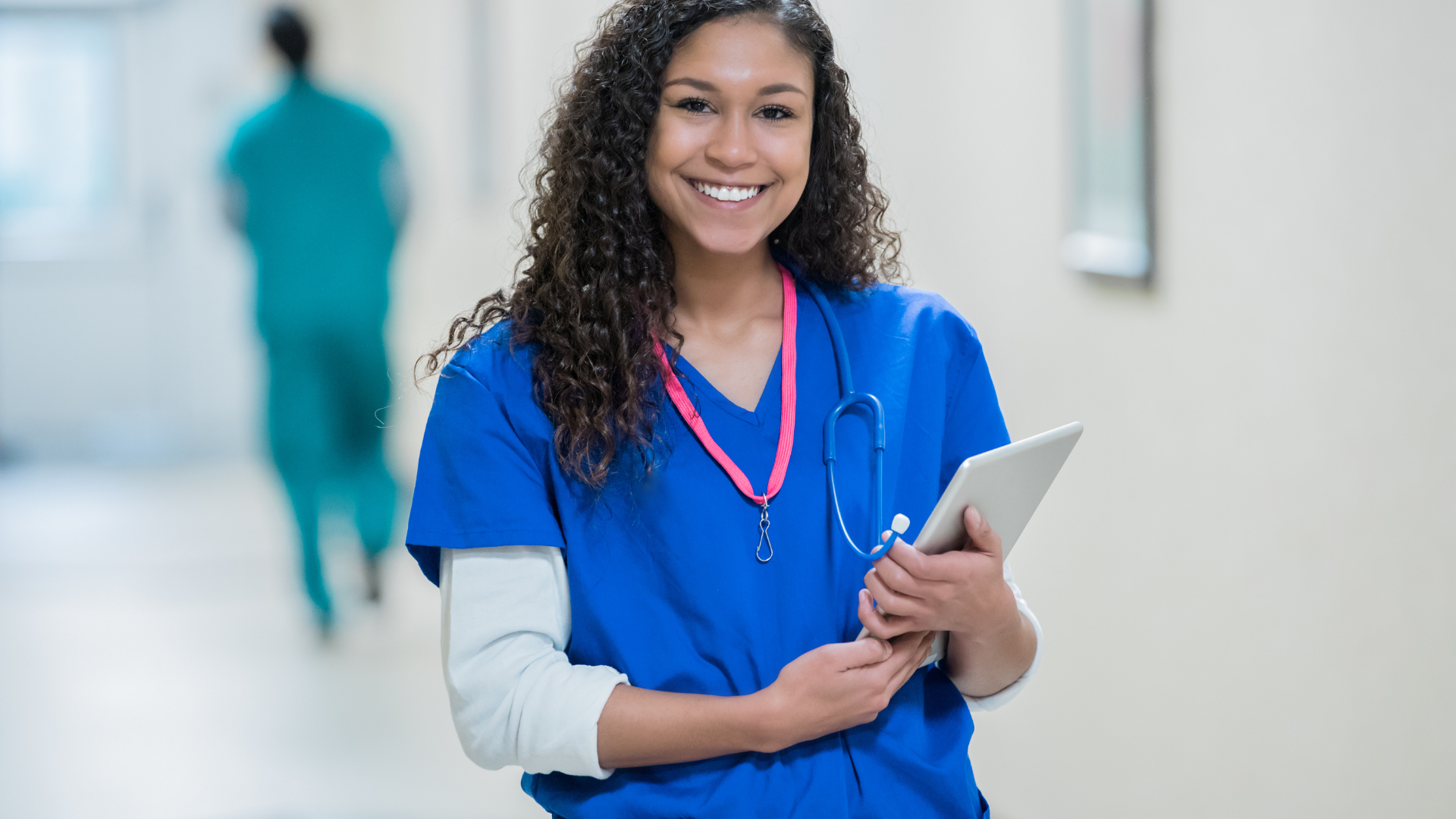 young-adult-female-nurse-is-holding-patient-chart-on-digital-tablet-in-hospital
